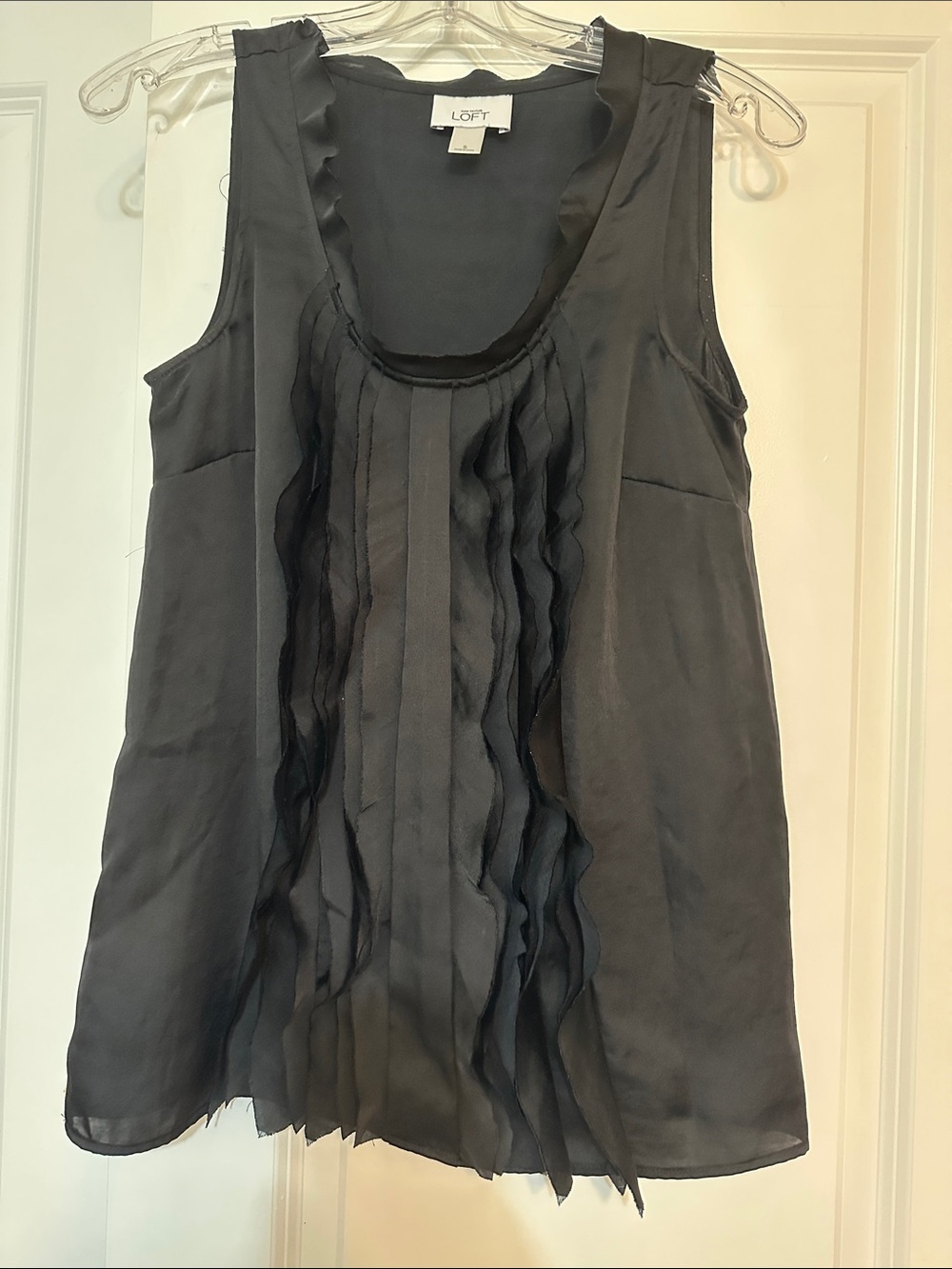Sz S Loft black sleeveless satin scoop neck blouse with a prominent ruffle front